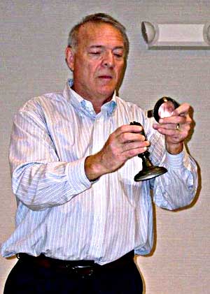 Photo of David Kilroy holding a Bulls-Eye Lens Lamp